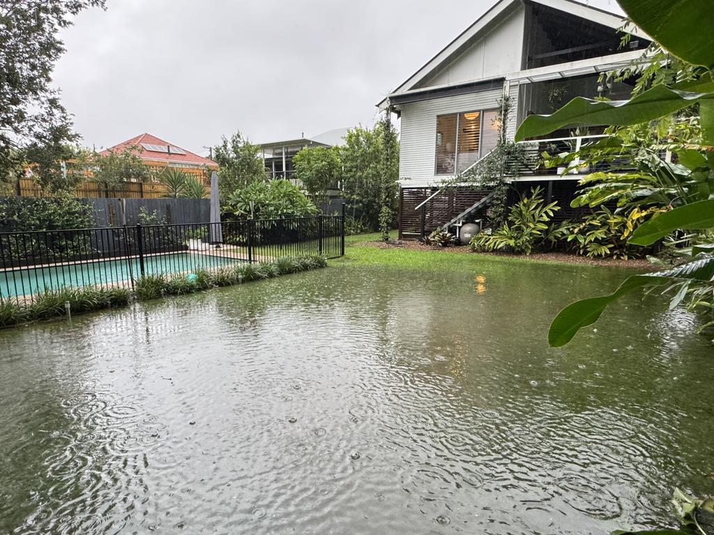 A flooded backyard in Kedron. Picture: Sean Callinan