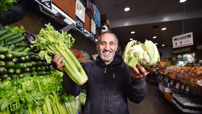 Alex Ali, who runs Eat More Fruit, at South Melbourne Market has got great prices on celery and cauliflower. Picture: Nicki Connolly