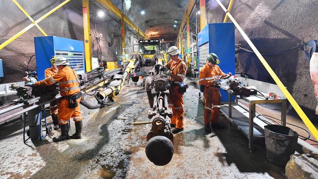 BHP workers are seen during a tour of the Olympic Dam mine site in Roxby Downs, South Australia, Friday, August 30, 2019. BHP officially launched its Underground School of Excellence at Olympic Dam, for people without experience in mining. (AAP Image/David Mariuz) NO ARCHIVING