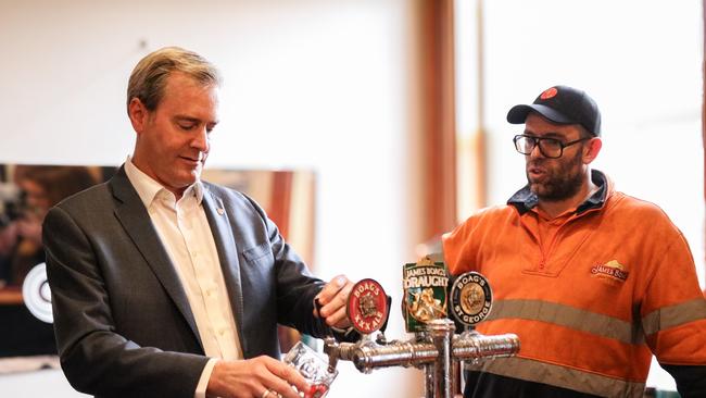 Treasurer Michael Ferguson pours a glass of Boag's beer at the current Boag’s Brewery tours and visitor centre in Launceston pictured with Boag's Brewhouse leader Charlie Rayner. Picture: Stephanie Dalton