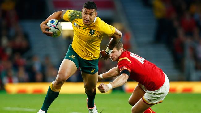 LONDON, ENGLAND - OCTOBER 10: Israel Folau of Australia evades a tackle by Dan Biggar of Wales during the 2015 Rugby World Cup Pool A match between Australia and Wales at Twickenham Stadium on October 10, 2015 in London, United Kingdom. (Photo by Mike Hewitt/Getty Images)
