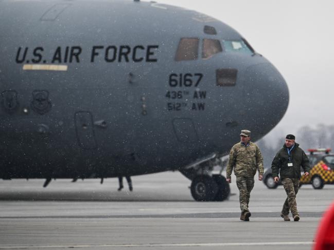 RZESZOW, POLAND - FEBRUARY 06: US Army General Christopher Donahue (L) and Polish Army General Wojciech Marchwica walk together in front of a U.S. Air Force Boeing C-17A Globemaster III transport aircraft at Jasionka Rzeszow Airport on February 06, 2022 in Rzeszow, Poland. Tensions between the NATO military alliance and Russia are intensifying due to Russia's move of tens of thousands of troops as well as heavy weapons to the Ukrainian border, causing international fears of a possible Russian invasion of Ukraine. (Photo by Omar Marques/Getty Images)