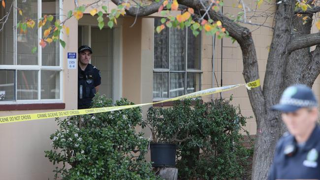 SA Police detectives and forensic examiners at the scene in Gilberton, just off James St. Picture: Emma Brasier