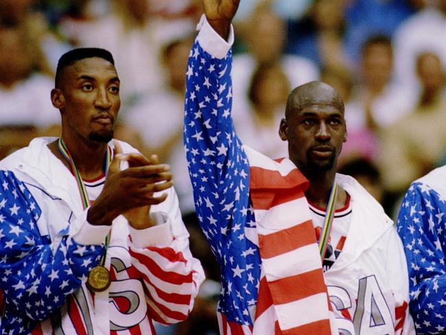 6 OCT 1992:  USA BASKETBALL TEAM MEMBERS MICHAEL JORDAN (MIDDLE) SCOTTIE PIPPEN (LEFT) AND CLIDE DREXLER (RIGHT) ACKNOWLEDGE THE CROWD AFTER RECEIVING THEIR GOLD MEDALAS MEMBERS OF THE DREAM TEAM DURING THE 1992 BARCELONA OLYMPICS IN BARCELONA, SPAIN. Man