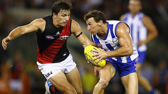 North Melbourne’s Brent Harvey and Essendon’s Michael Hibberd might be squaring off on Good Friday in 20. Picture Michael Klein Source: News Corp Ausralia