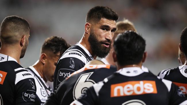 James Tamou talks to his teammates after another Titans try at Campbelltown Stadium. Picture: Matt King/Getty Images