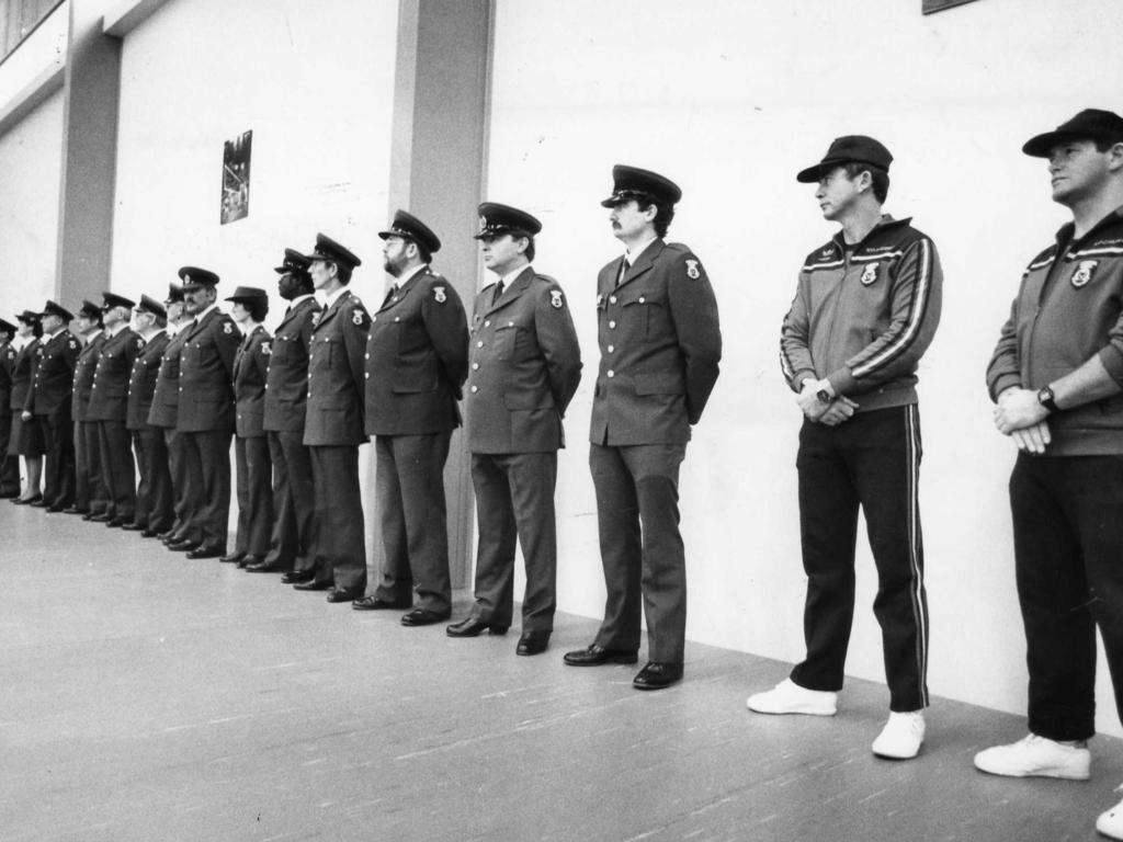 Correctional officers line the wall of the gym during the opening ceremony of the Adelaide Remand Centre in August 1986.