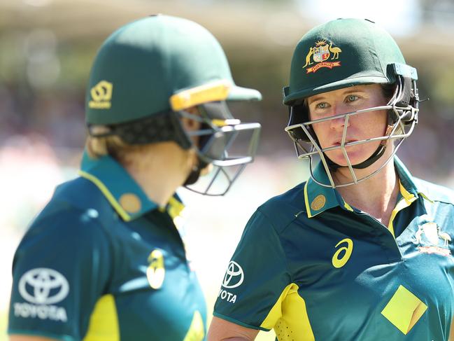 CANBERRA, AUSTRALIA - JANUARY 28:  Alyssa Healy and Beth Mooney of Australia talk before walking out to open the batting during game two of the Women's T20 International series between Australia and South Africa at Manuka Oval on January 28, 2024 in Canberra, Australia. (Photo by Mark Metcalfe/Getty Images)