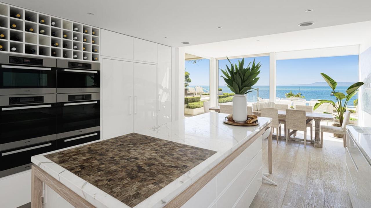 The home’s lavish kitchen featuring views of the bay.