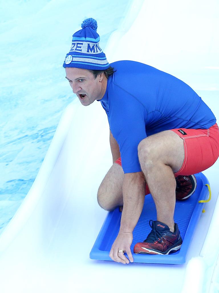 Luke Beveridge surfed down the slide. Picture: Michael Klein