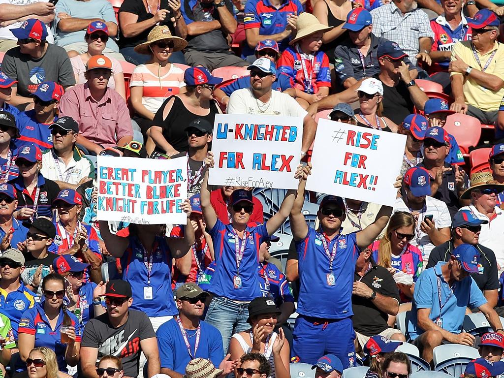 Knights fans hold up a sign as a tribute to Alex McKinnon. Picture: Getty Images