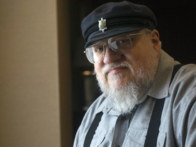 FILE - In this March 12, 2012 file photo, George R.R. Martin, author of the popular book series "A Song of Ice and Fire," which inspired the hit HBO series "Game of Thrones" poses in Toronto. Martin says the next â€œSong of Ice and Fireâ€ book has a real chance of coming out in 2018. In a weekend posting on his web site, Martin wrote that he is working hard on â€œThe Winds of Winter,â€ the long-awaited sixth volume in the series. He added that he has â€œgood days and bad daysâ€ and is still months away from finishing.    (AP Photo/The Canadian Press, Nathan Denette, File)