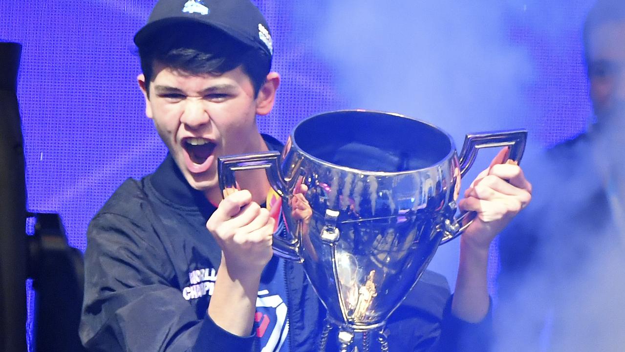 Kyle Giersdorf, who plays as “Bugha”, celebrates with the trophy after his win. Picture: AFP