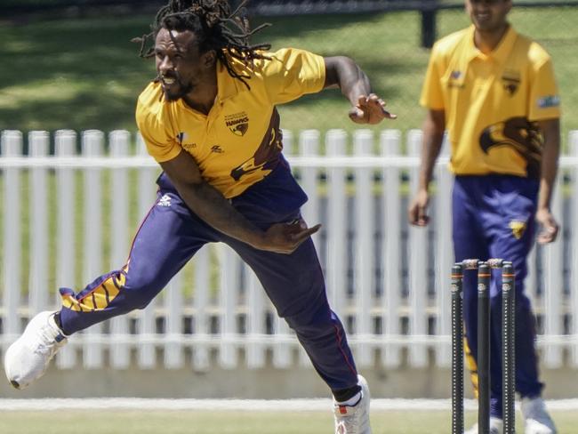 Romain Grenville bowling for the Hawks.