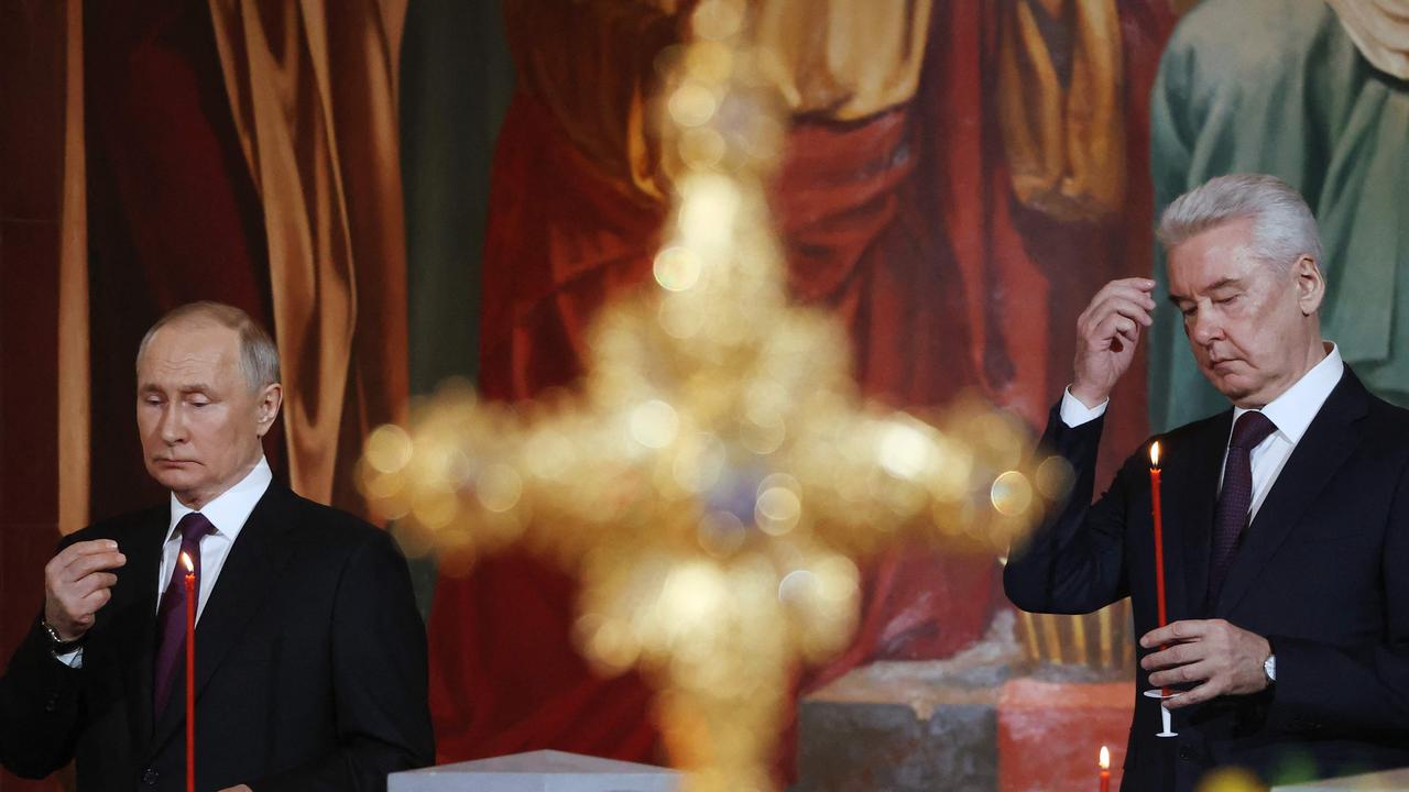 Vladimir Putin and Moscow's Mayor Sergey Sobyanin attend an Orthodox Easter service in Moscow. Picture: AFP