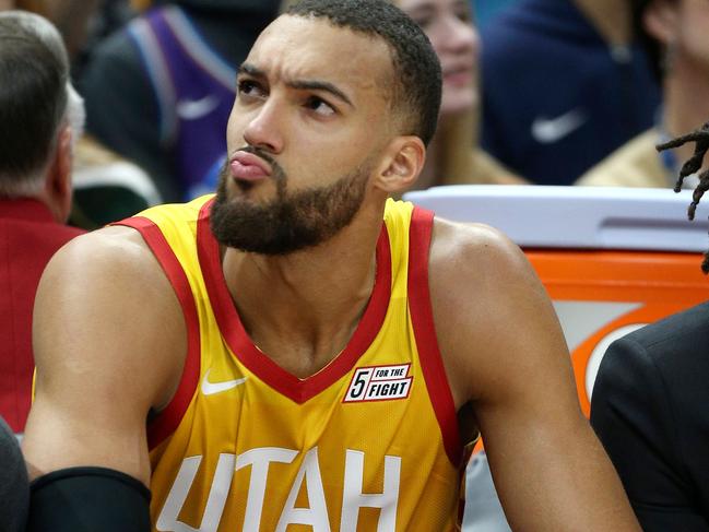 (FILES) In this file photo taken on December 04, 2019 Utah Jazz center Rudy Gobert looks at the fans in the stands during an NAB game against the Los Angeles Lakers in Salt Lake City, Utah. - The NBA will suspend play starting on Thursday after a Utah Jazz player preliminarily tested positive for the new coronavirus, the league said March 11, 2020. The test result was reported shortly before Utah's game against the Thunder in Oklahoma City was to begin, and that game was abruptly postponed. The NBA did not name the player who had tested positive, but several US media outlets reported it was French defensive standout Rudy Gobert, who was listed first as questionable for the game and then as out with illness. (Photo by GEORGE FREY / AFP)