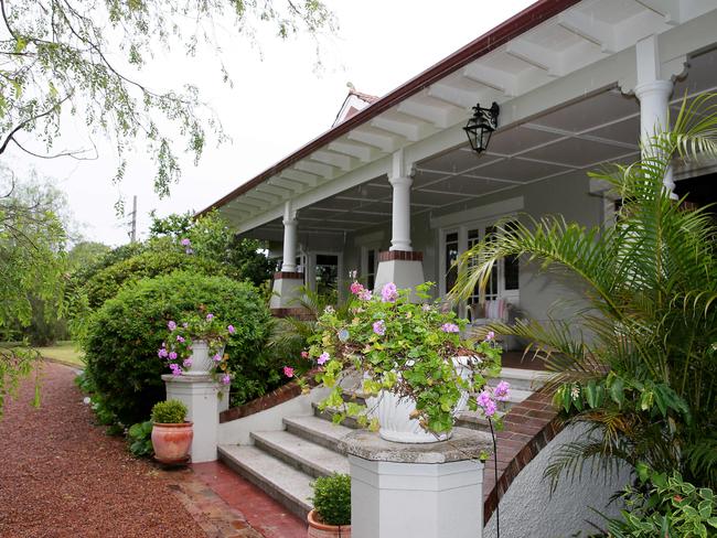 This elegant Cheltenham home is surrounded by park-like grounds.