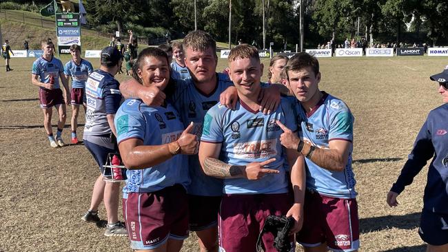 Norths players celebrate their win.