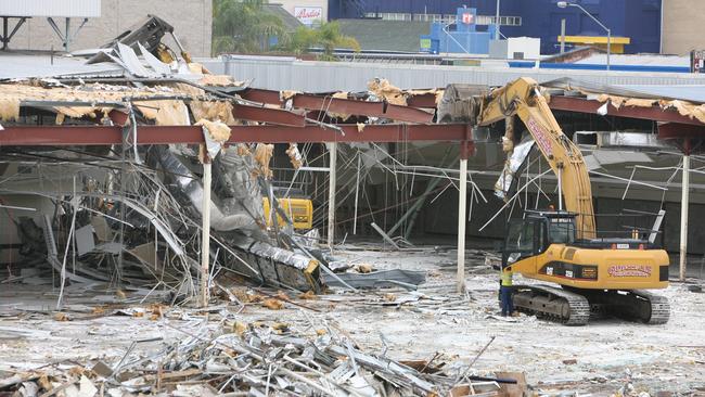 Coles regional manager Tim Scales and Ipswich Mayor Paul Pisasale watch the flood damaged Coles building in the Ipswich cbd get demolished. Photo: Rob Williams / The Queensland Times