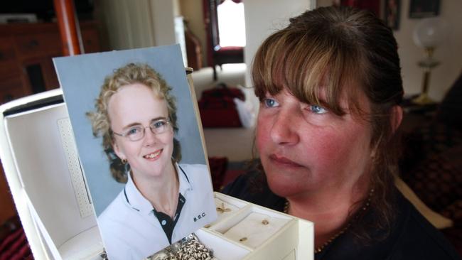 Karen, mother of Krystal Fraser, looks at her daughter’s photo and jewellery box.