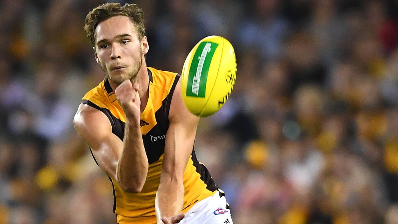 Jack Scrimshaw gets a handball away against St Kilda on Sunday.