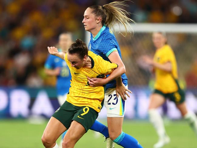 BRISBANE, AUSTRALIA - NOVEMBER 28: Caitlin Foord of Australia battles for possession with Isa Haas of Brazil during the International Friendly match between the Matildas and Brazil at Suncorp Stadium on November 28, 2024 in Brisbane, Australia. (Photo by Chris Hyde/Getty Images)