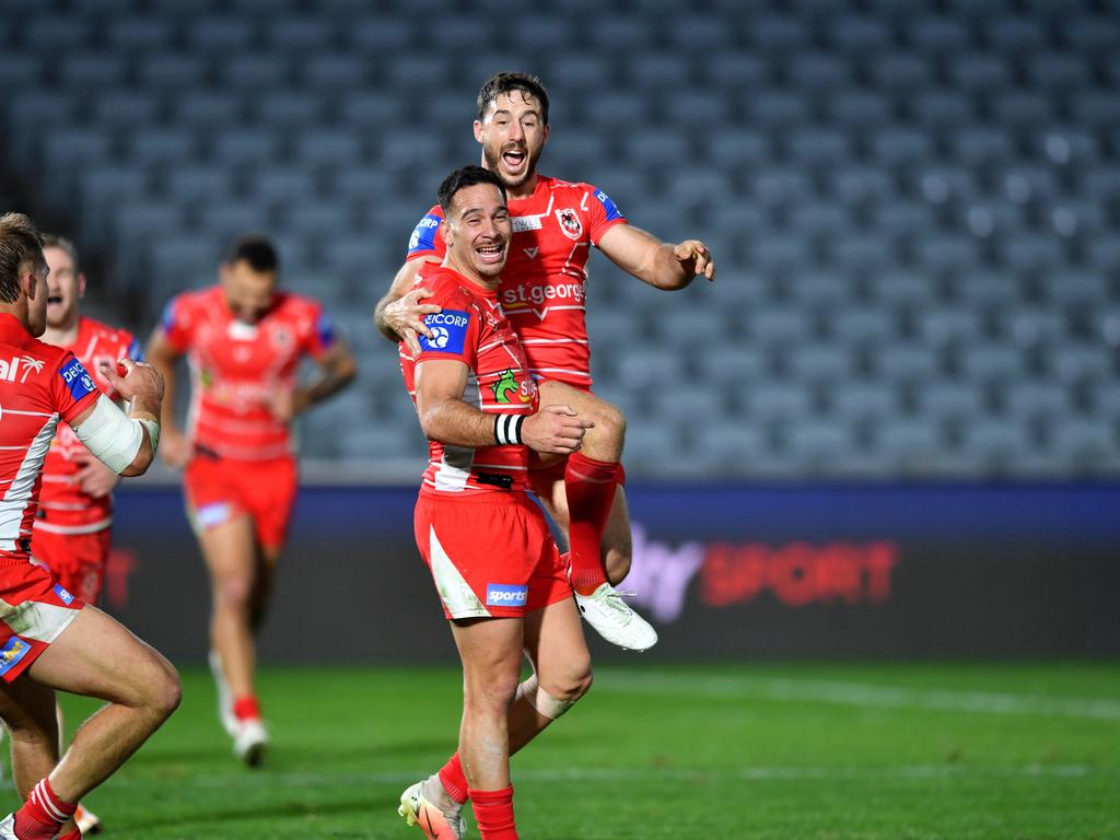 Corey Norman and Ben Hunt celebrate after the winning field goal. Picture: Gregg Porteous/NRL Images