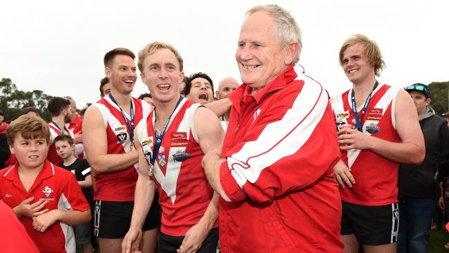 Healesville seniors coach Jack Cole makes his way on to the podium to collect the trophy. Picture: Steve Tanner