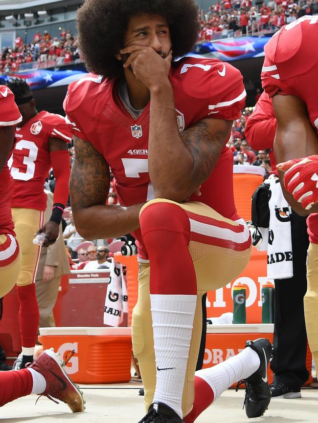 Colin Kaepernick #7 of the San Francisco 49ers kneels on the sideline during the anthem prior to a game against the Dallas Cowboys. Picture: AFP