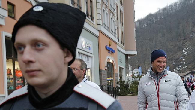 Cossacks and athletes but no snow in the streets of Sochi.