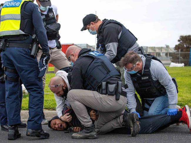 A man is arrested during the construction worker protest. Picture: Mark Stewart