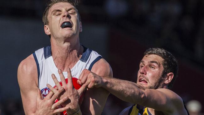 Adelaide’s leading intercept player Jake Lever picks the ball off in front of West Coast’s Jack Darling during the round 23 match at Subiaco Oval. Picture: Tony McDonough (AAP).