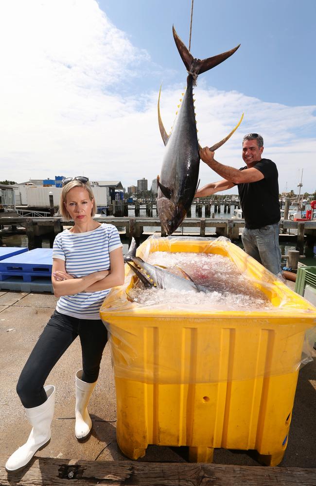 Heidi and Pavo Walker owners of Walkers Seafoods, with a huge yellow fin tuna, at Mooloolaba jetty. Picture: Lyndon Mechielsen/The Australian