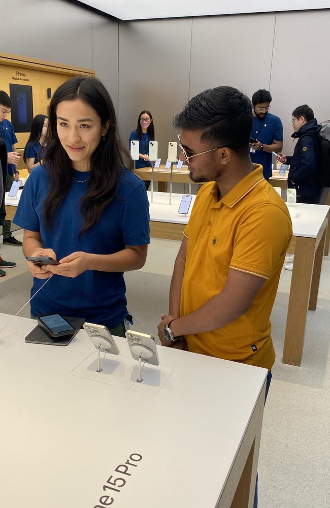 Badsha Bulbul (right) lined up at 11pm the night before to get the new iPhone 15. Picture: Jack Evans