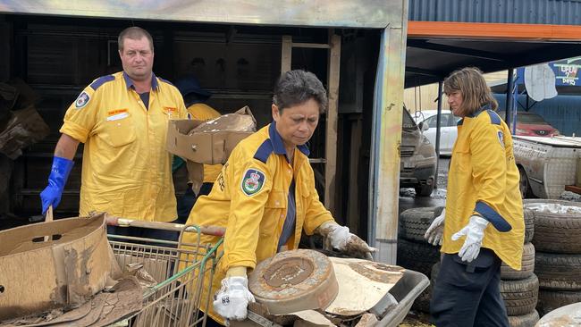 NSW Rural Fire Service volunteers during the major clean-up in South Lismore at North Coast Wholesale Cars.