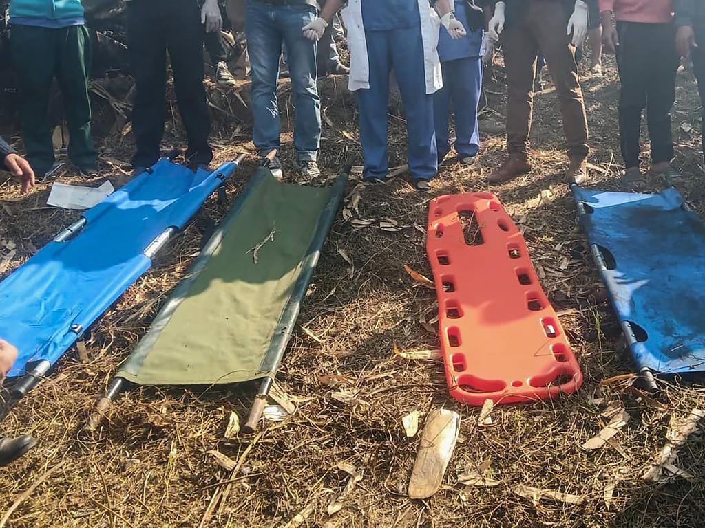 Rescuers gather at the site of a plane crash in Pokhara, Nepal. Picture: Bishan Chetri/Anadolu Agency via Getty Images