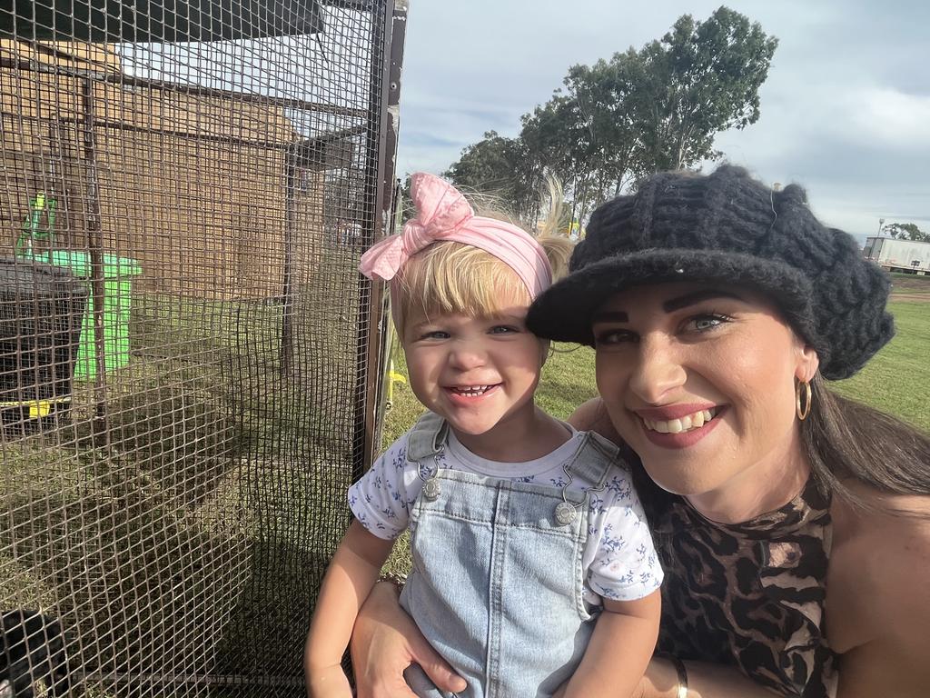 Lorrin Bosel with her daughter Lacee looking at the baby animals.
