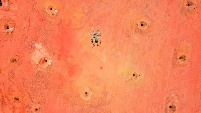 Drones inspecting drill holes on a mine site. A job that would take humans two days now takes two hours.