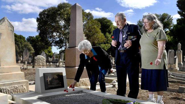 Monday 26 April, 2021 - Family members of Private Andrew James Marshall Ã his grandchildren (L-R) Joy Parker (89), Ron Wallace (aged 90) and Robyn Wallace (73) at the  graveside of their grandfather, after a long quest to have his war service recognised. Private Marshall died on 25 September 1914 (aged 29) after contracting pneumonia at Morphettville Camp. He was buried in an unmarked grave. Picture - Naomi Jellicoe