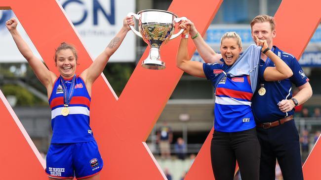 Brennan on stage with captain Ellie Blackburn after the Bulldogs’ grand final win. Picture: Mark Stewart