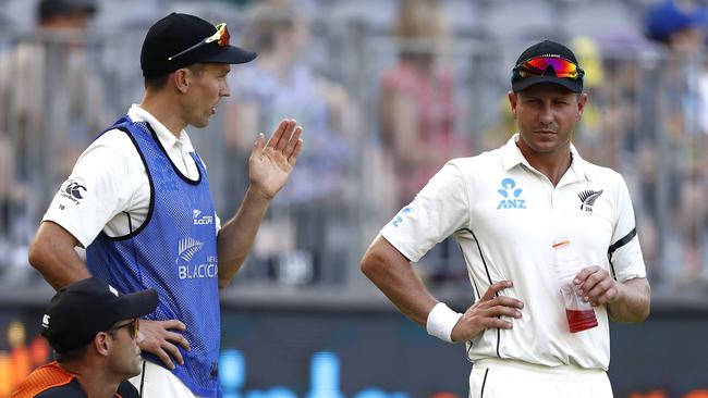 Trent Boult, left, and Neil Wagner talk tactics during the Perth Test