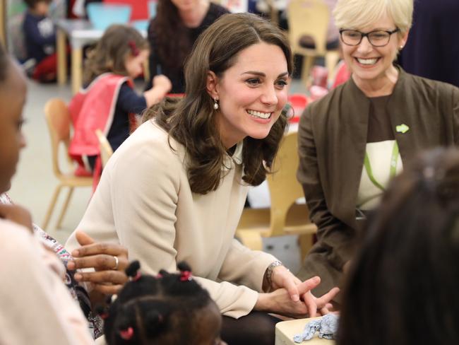 Britain's Kate, the Duchess of Cambridge speaks to children during a visit to the Hornsey Road Children's Centre in London, Tuesday, Nov. 14, 2017. The Duchess saw some of the valuable family and parental support services which are delivered at the Centre, including those offered by the charity Family Action, of which The Queen is Patron. (Richard Pohle/Pool Photo via AP)