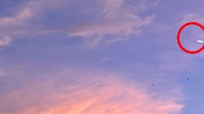 Cairns man Charles Budby found an unidentified flying object in a photo he took of the clouds while waiting for dinner at the Civic Shopping Centre on McLeod Street.