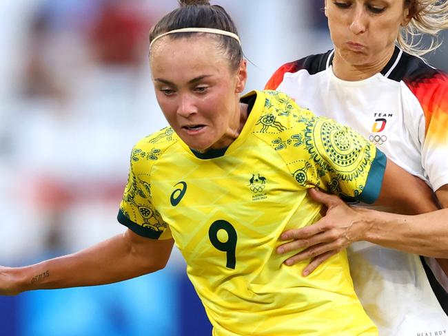 MARSEILLE, FRANCE - JULY 25: Caitlin Foord #9 of Team Australia is challenged by Kathrin Hendrich #3 of Team Germany during the Women's group B match between Germany v Australia during the Olympic Games Paris 2024 at Stade de Marseille on July 25, 2024 in Marseille, France. (Photo by Alex Livesey/Getty Images)