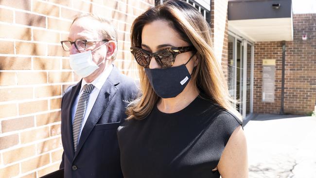 High-profile beauty therapist Kristin Fisher leaving court.