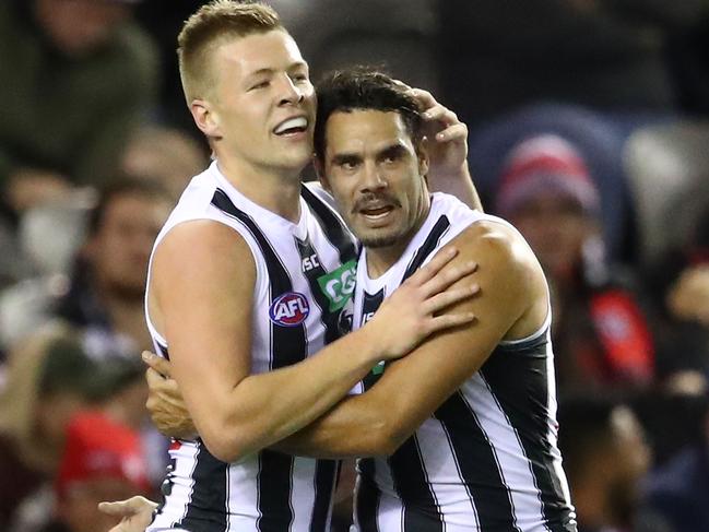 MELBOURNE, AUSTRALIA - MAY 19:  Jordan De Goey of the Magpies and Daniel Wells of the Magpies celebrate after kicking a goal during the round nine AFL match between the St Kilda Saints and the Collingwood Magpies at Etihad Stadium on May 19, 2018 in Melbourne, Australia.  (Photo by Scott Barbour/Getty Images)