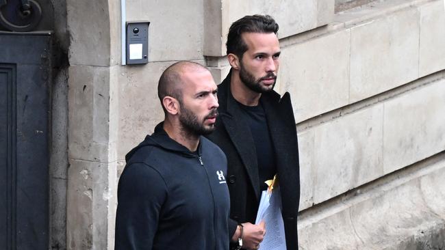 Andrew Tate and his brother Tristan leave a court in Bucharest, Romania. Picture: Daniel Mihailescu/AFP