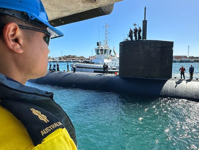 ROCKINGHAM, Western Australia (March 10, 2024) – U.S. Navy Sailors assigned to the Los Angeles-class fast-attack submarine USS Annapolis (SSN 760) and HMAS Stirling Port Services crewmembers prepare the submarine to moor alongside Diamantina Pier at Fleet Base West in Rockingham, Western Australia, March 10, 2024. The nuclear-powered, conventionally-armed submarine is in HMAS Stirling for the second visit by a fast-attack submarine to Australia since the announcement of the AUKUS (Australia, United Kingdom, United States) Optimal Pathway in March 2023. (U.S. Navy photo by Cmdr. Erik Wells)