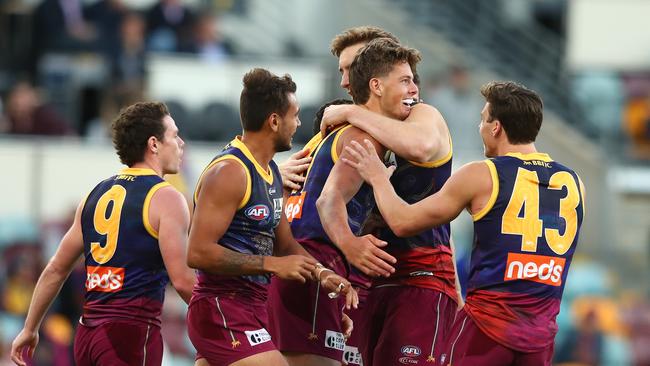 Tom Fullarton was swamped by teammates after his first AFL goal. Picture: Getty Images