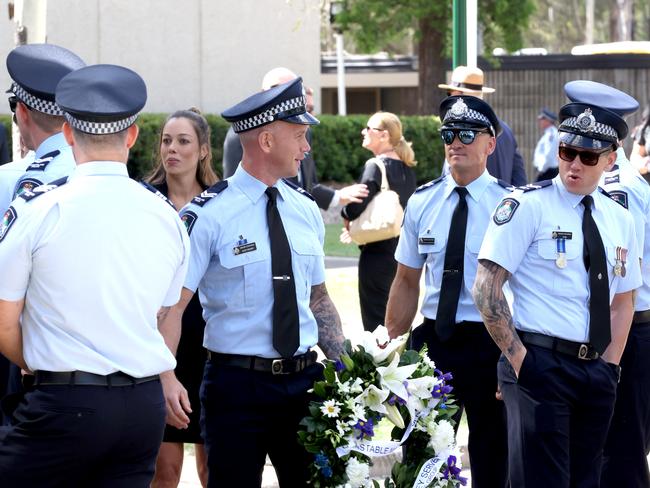 Mourners at the memorial service with full police honours for constables Rachel McCrow and Matthew Arnold at Brisbane Entertainment Centre. Picture: Steve Pohlner